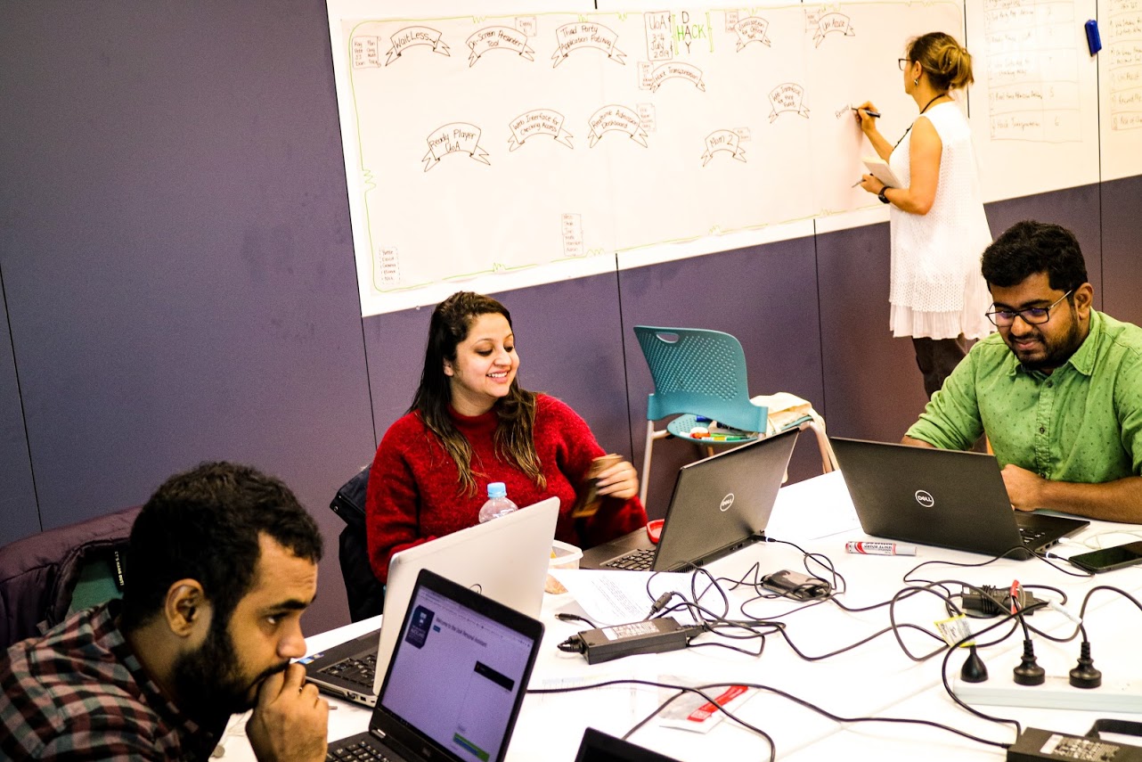 Teams pitching their ideas at Hack Day
